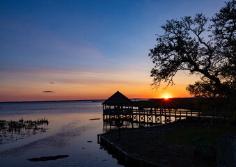 People enjoy sunset in  gazebo in Corolla, Outer Banks, NC