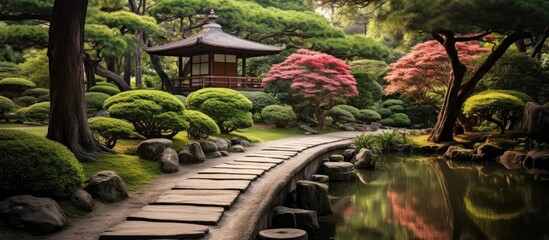 Poster - A beautiful pathway in a serene Japanese garden with oriental features, surrounded by lush greenery and peaceful ambiance, ideal for a copy space image.