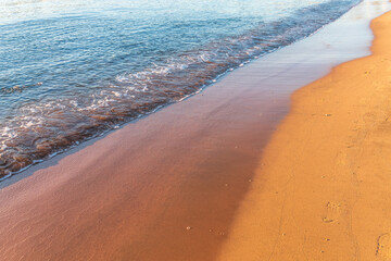 Wall Mural - Soft wave of the sea on the sandy beach.