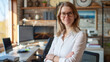 © Maksym - Confident European woman real estate agent stands proudly in a modern home office setup with ergonomic furniture and multiple screens, radiating expertise and approachability, read