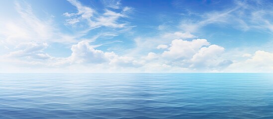Poster - Seascape featuring a tranquil sea under a vast blue sky with trees on the horizon, providing a serene backdrop for a copy space image.