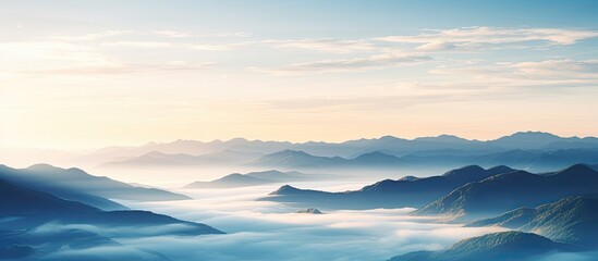 Poster - Scenic misty sunrise over mountains with clouds, perfect for a copy space image.