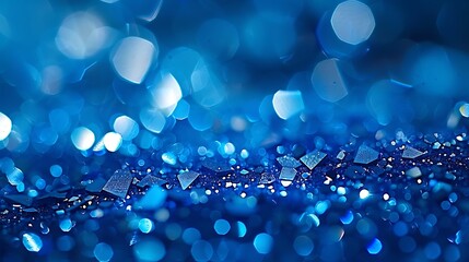 Wall Mural - Sparkling sapphire blue bokeh background from light reflecting on water droplets presenting a cool and refreshing abstract texture. 