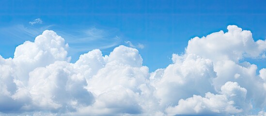 Aufkleber - Blue sky with fluffy clouds provides a serene copy space image.