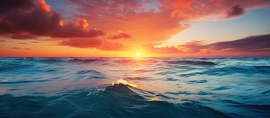 Poster - Beautiful turquoise waves in the ocean off the coast of Cozumel with a stunning sunset in the background in this copy space image.