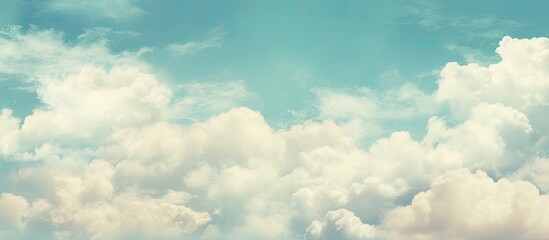 Wall Mural - vintage style picture of a blue sky with clouds, featuring a copy space image.