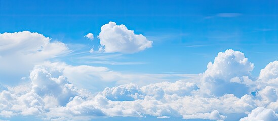 Aufkleber - Blue sky with fluffy clouds offers a serene copy space image.