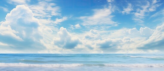 Poster - Scenic sky with fluffy clouds above the ocean with copy space image.