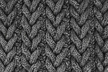 Poster - A black and white photo of a handmade knitted blanket
