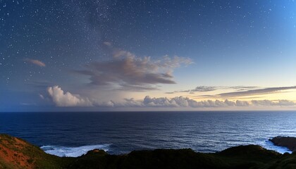 Wall Mural - photo of a serene night sky with twinkling stars and wispy clouds over a vast ocean
