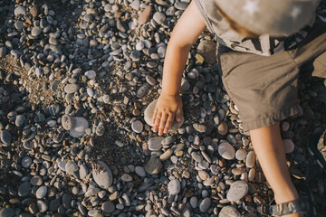 cute happy boy by the sea. beach holidays with children 