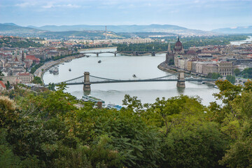 Cityscape with Danube river and chain bridge in the middle.