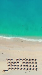 Wall Mural - Beautiful Myrtos beach at sunny day on Kefalonia island, Ionian sea, Greece. Top down view of the idyllic white sandy beach with beautiful turquoise sea water. Perfect summer holidays destination