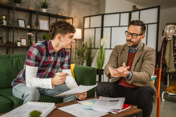 Adult exhausted professor mentor explain young student lesson at home