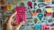 © JKLoma - hand holding a sticky note with 'Big Idea' against a background filled with colorful doodles and sketches, symbolizing brainstorming and creative planning generative ai