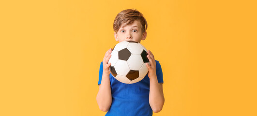 Sticker - Cute little boy with soccer ball on color background