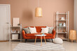 © Pixel-Shot - Interior of stylish living room with brown sofa and coffee table near beige wall
