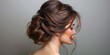 © tanapat - Elegant rich brown hair in an updo, the strands reflecting a soft, natural luster under soft lighting