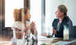© ArcursPI/peopleimages.com - Woman, client and financial advisor in meeting for talking, discussion and consulting for investment. Glass, explaining and accountant in office speaking of taxes, advice and feedback with contract