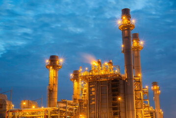 Gas turbine electrical power plant at dusk - factory - petrochemical plant