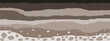 © Kavik - Layered brown soil and rock subsurface. Soil layer cross section