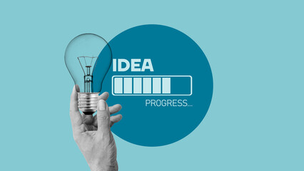 Poster - Loading idea business concept and progress. Idea loading concept with light bulb on blue background. Creativity for business idea and problem solving. Brainstorm in progress