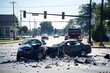 © Ratchadaporn - Dramatic Car Accident Scene at Busy Intersection with Visible Vehicle Damage and Debris Scattered on the Road