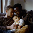 © imountain - lgbtq couple and their child indoors