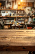 © grey - A wooden workbench in the foreground with a blurred workshop in the background