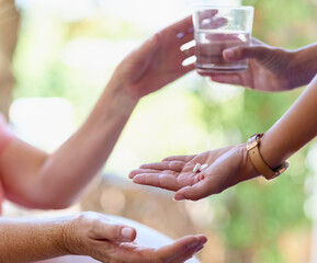 Wall Mural - Nurse, hand and medicine with water at nursing home for patient medical treatment, supplements or support of healthcare. People, caregiver and prescription pills, drugs or glass for health diagnosis