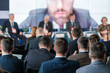 © Anton Gvozdikov - Audience listening to a business presentation at a conference. Back view of professionals attending a speaker panel. Concept of networking, learning, and professional growth.