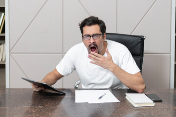 Wall Mural - Tired frustrated and overworked business man sitting in the office and thinking about problems in business	