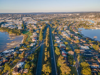 Wall Mural - Aerial drone view over Taren Point in Sutherland Shire, Sydney NSW, Australia looking over Taren Point Road toward Caringbah on a sunny morning in May 2024