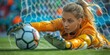 © Stone Story - Focused female goalkeeper diving to catch the soccer ball during an intense match, showcasing athletic skills and concentration.