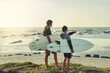 © Lyndon Stratford/peopleimages.com - Learning, surf and kids on beach with board for adventure on vacation, holiday or sport in water. Child, surfer and search the current in waves for safety on island in summer, pointing or teens relax
