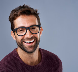 Fototapete - Portrait, smile and man on studio background for startup business with smart and intelligent face. Creative worker, entrepreneur or IT expert in glasses for eye care, vision or confidence in tech job