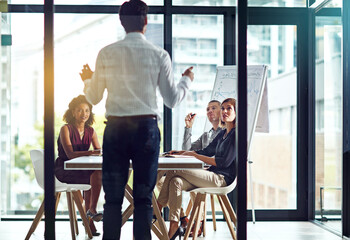 Poster - Businessman, presentation and discussion for finance in conference room with auditing team for company growth and annual sales. Speaker, back and employee in meeting for project strategy in boardroom