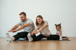 © standret - Family of mother, father and daughter are doing yoga at home