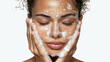 © sema_srinouljan - young woman washing face and touching healthy clean skin
