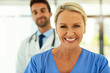 © C Pendl�/peopleimages.com - Portrait, woman and happy nurse in hospital for healthcare service, coworking or medicine. Face, medical professional and expert surgeon, employee and physician working at wellness clinic with team