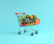 © HAMNA - Shopping Cart with Utensils Fruits and Vegetables the Market plain background banner