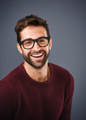 Poster - Studio, glasses and man with lens, portrait and wellness with eye care, product and frame for vision. Black background, face and happiness for person, prescription and eyewear with fashion in USA