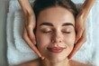 © Grigor - Beautiful woman getting a facial massage at a spa salon.
