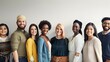© Felippe Lopes - Diverse group of young adults smiling together against a neutral background, representing unity and multiculturalism in a professional setting.