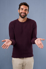 Aufkleber - Studio, smile and gesture of man, question and confused with shrug, portrait and wondering of news. Blue background, face and happiness of person, asking and unsure with hands, fashion and cardigan
