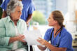 © peopleimages.com - Doctor, senior woman and documents for discussion in hospital, medical results or treatment with health insurance. Medic, patient and wheelchair for paperwork, history or evaluation of information