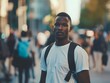 © Moon Story - A young man wearing a white shirt and backpack stands in a busy city street