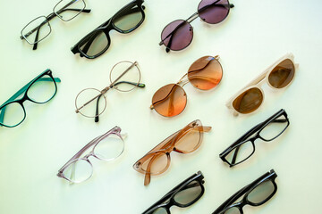 Canvas Print - Flat lay of eyeglasses with different lenses, top view. Eyes healthcare concept