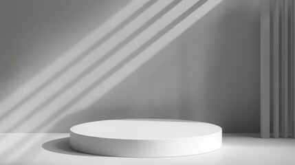 Leinwandbilder - A round white pedestal sits in a sunlit room with shadow patterns on a gray wall, creating a minimalist, serene atmosphere.