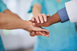 © Meeko Media - Diverse Medical Team Putting Hands Together in Unity and Cooperation